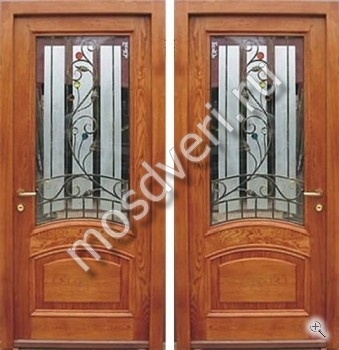 Элитная металлическая дверь с отделкой массивом дуба, стеклом и кованой решеткой - купить от производителя Мосдвери Элитная металлическая дверь с отделкой массивом дуба, стеклом и кованой решеткой